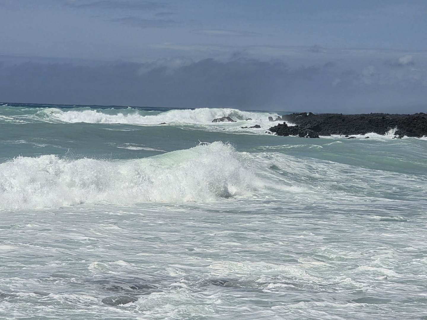 A large wave breaking over a lava shelf at Waikoloa, South Kohala, during the Hurricane Lowell swell